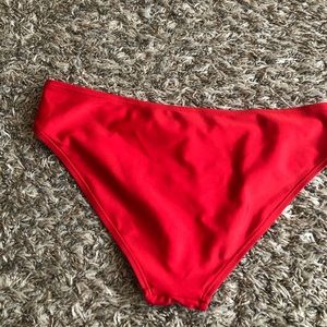 Never worn red swimming suit bottoms